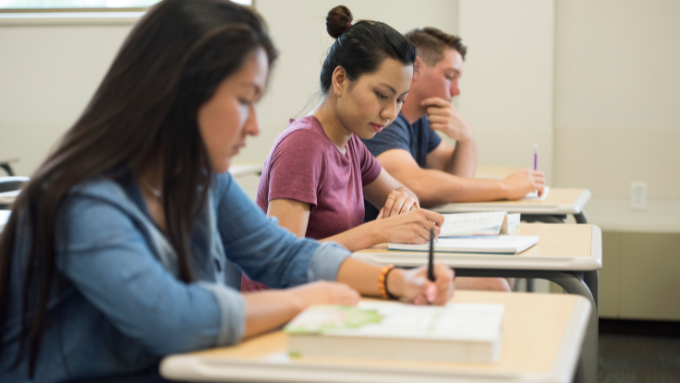 students writing at desks