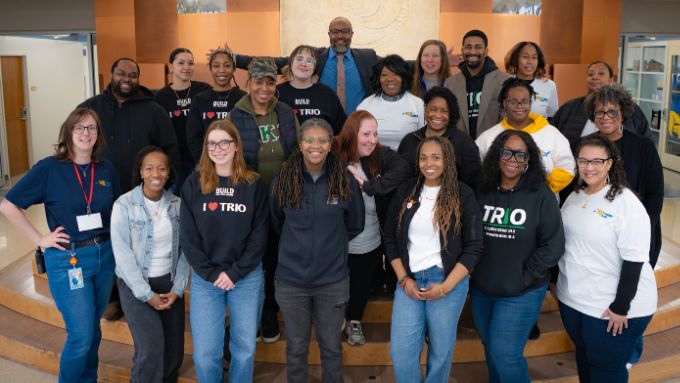 a group of diverse adults stand together