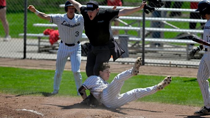 Logan Lott calling a player safe during the Midwest Conference Tournament last fall.