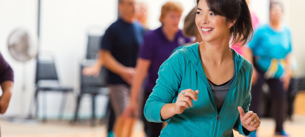 female in front of dance class