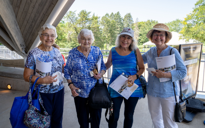 four women attending annual membership meeting
