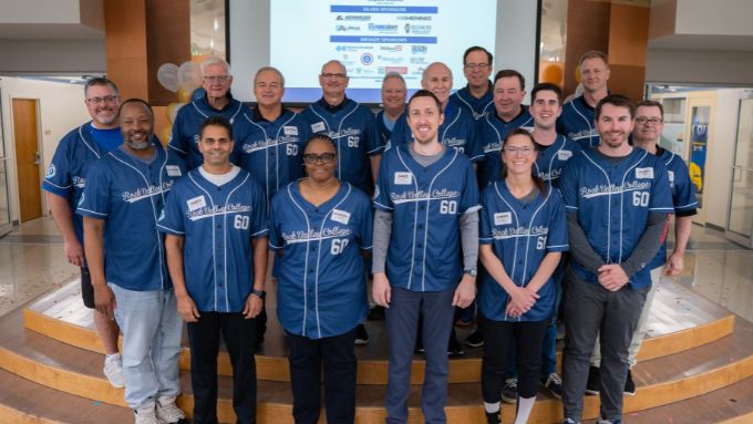 Group of CEOs wearing RVC baseball jerseys