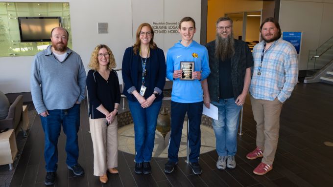 Gustafson math award winner with his parents on left, professors on right