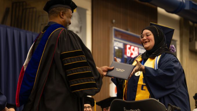 RVC graduate receiving her diploma on stage