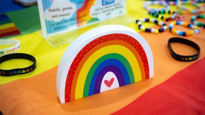 A rainbow displayed on rainbow table along with beaded bracelets