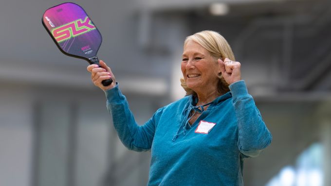 Older woman enjoying a game of pickleball