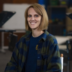 portrait of Lonnie Iske wearing a blue and green flannel