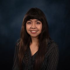 youn hispanic woman with long brown hair 