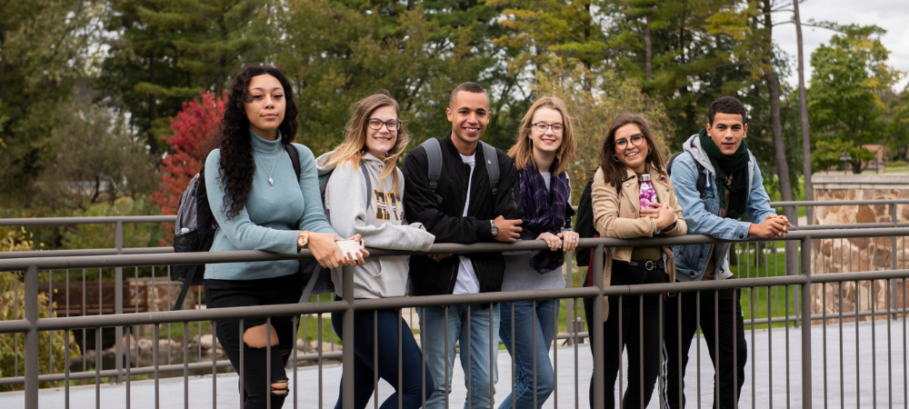 group of students on main campus bridge